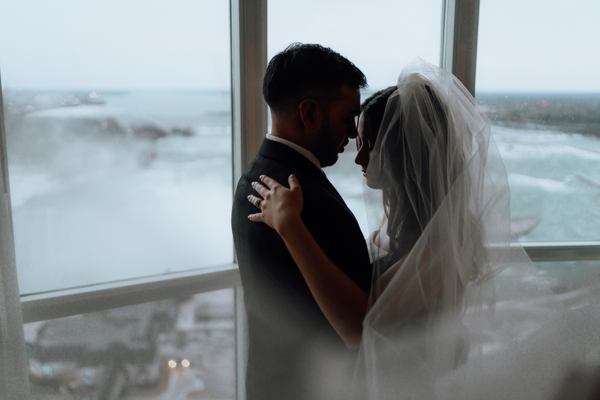 Bride in veil with natural window lighting